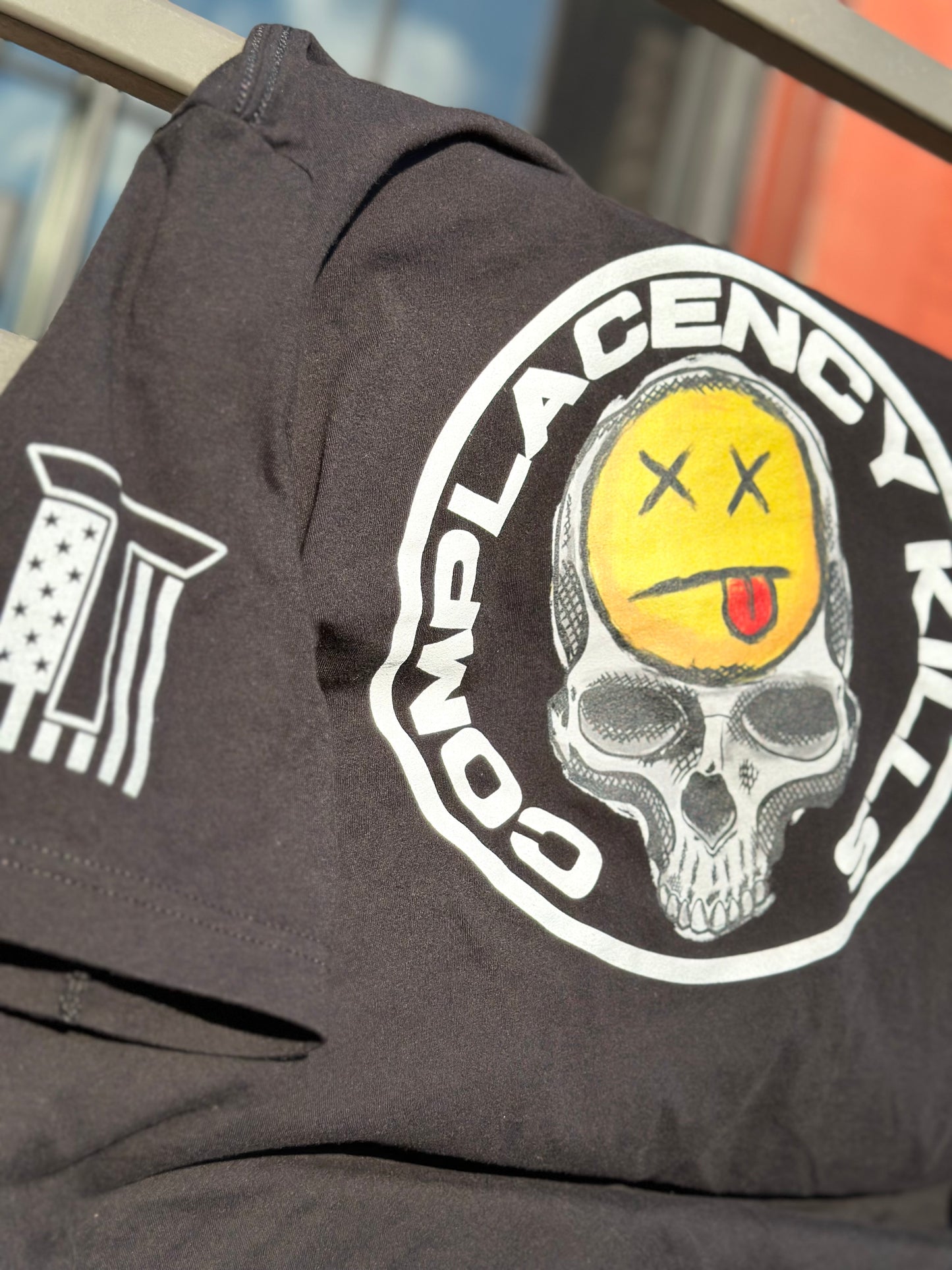 COMPLACENCY KILLS TEE