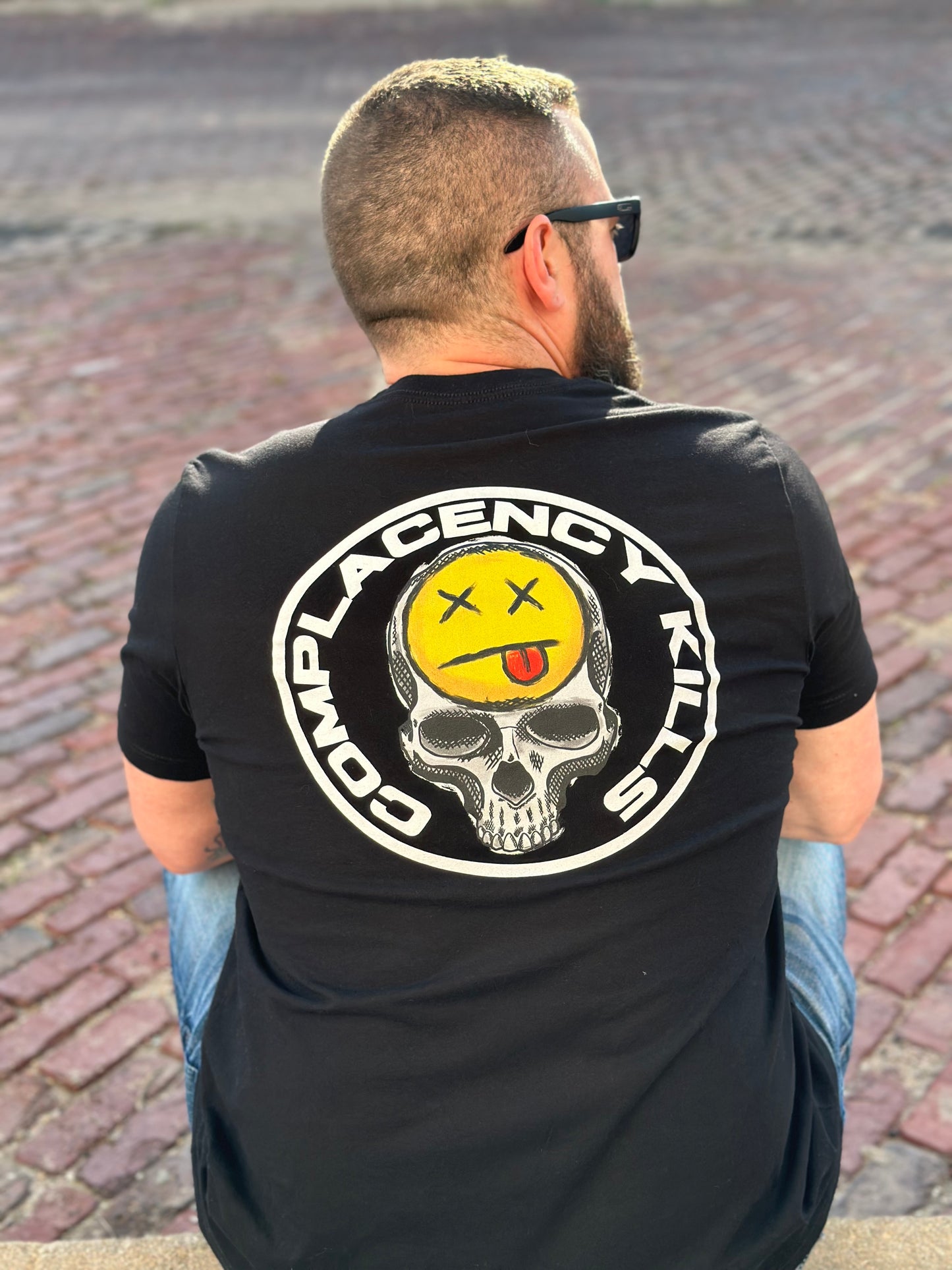 COMPLACENCY KILLS TEE